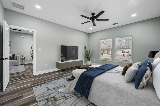 bedroom with ceiling fan and dark hardwood / wood-style floors