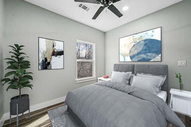 bedroom featuring ceiling fan and hardwood / wood-style flooring