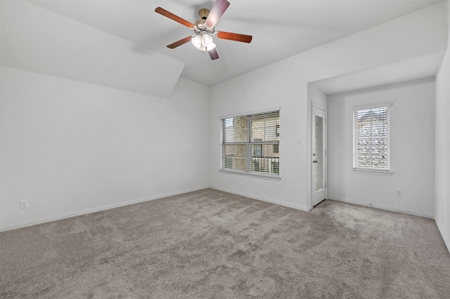 carpeted empty room featuring ceiling fan