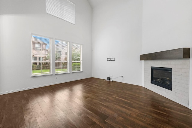 unfurnished living room with dark hardwood / wood-style flooring