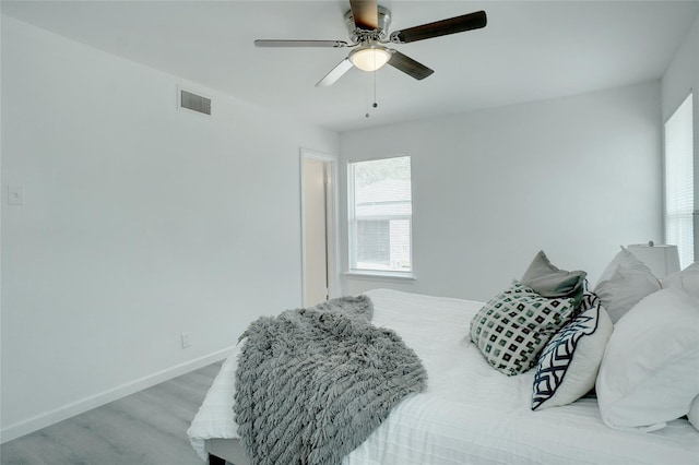 bedroom featuring ceiling fan and light hardwood / wood-style flooring