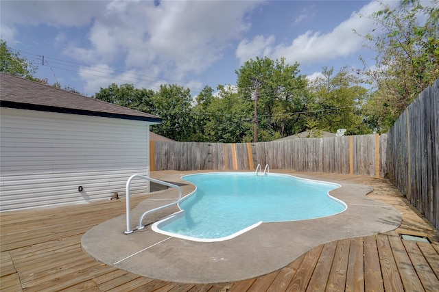 view of pool with a wooden deck