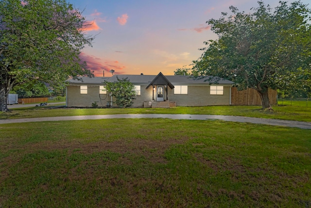 view of front of house with a yard