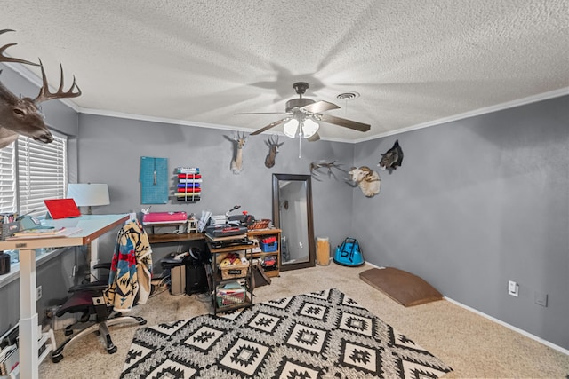 carpeted office featuring ceiling fan, a textured ceiling, and ornamental molding