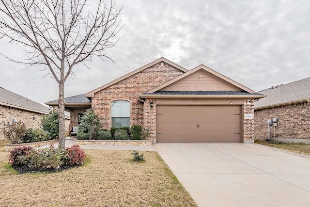 ranch-style house with a front yard and a garage