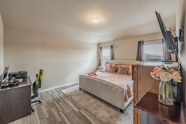 bedroom featuring light wood-type flooring