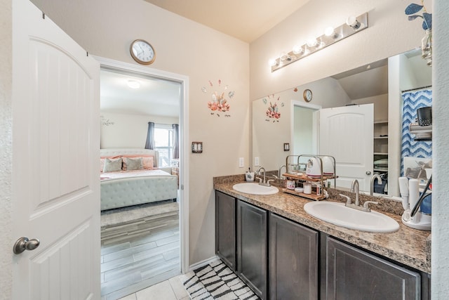 bathroom featuring tile patterned flooring and vanity