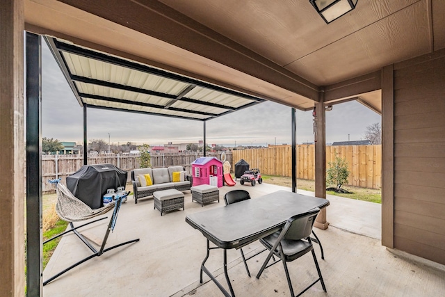 view of patio / terrace featuring an outdoor living space and a grill