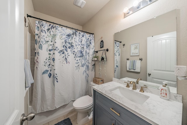 full bathroom featuring toilet, shower / bath combination with curtain, tile patterned floors, and vanity