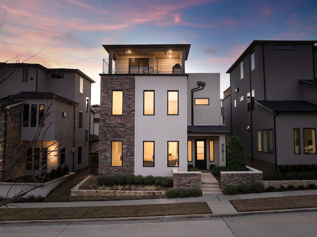 contemporary home with a balcony