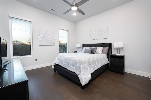 bedroom with dark wood-type flooring and ceiling fan