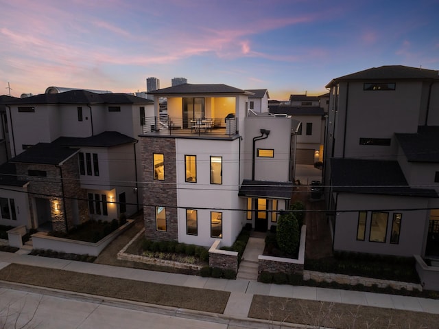 view of front of home with a balcony