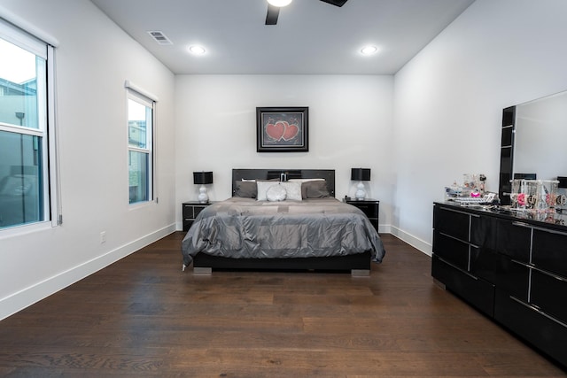 bedroom with ceiling fan and dark hardwood / wood-style floors