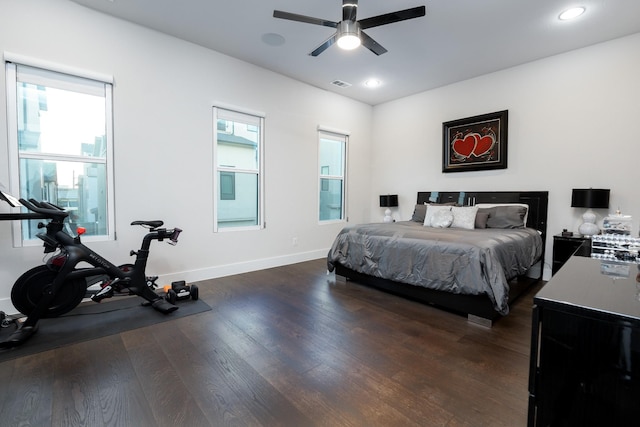 bedroom featuring ceiling fan and dark hardwood / wood-style flooring