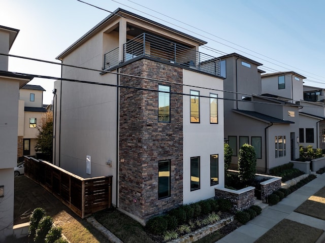 view of property exterior with a balcony