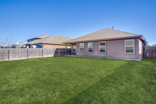 rear view of house with a lawn