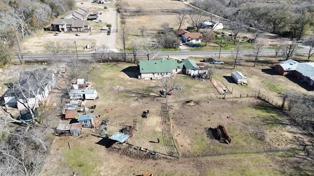 birds eye view of property with a rural view