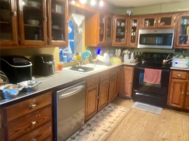 kitchen with appliances with stainless steel finishes and sink