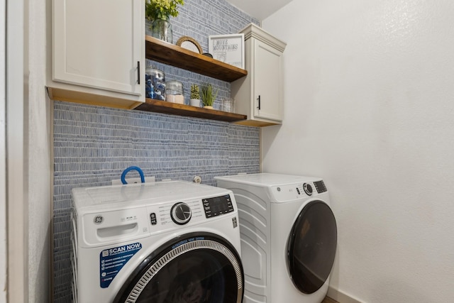 laundry room with cabinets and washing machine and dryer