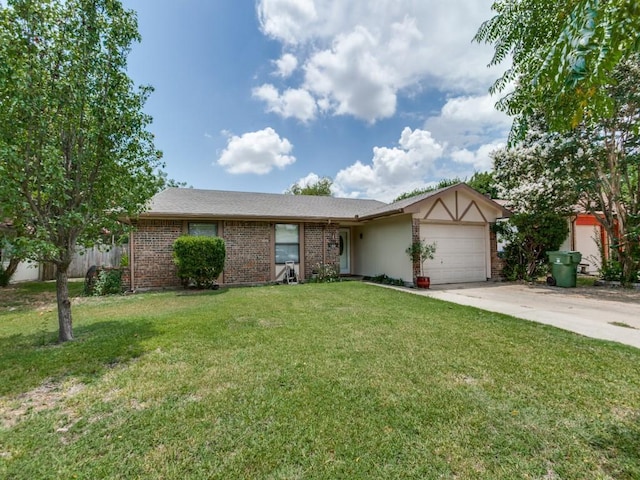 view of front of home with a front yard and a garage