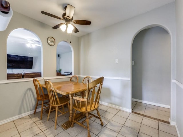 dining area with ceiling fan and light tile patterned floors