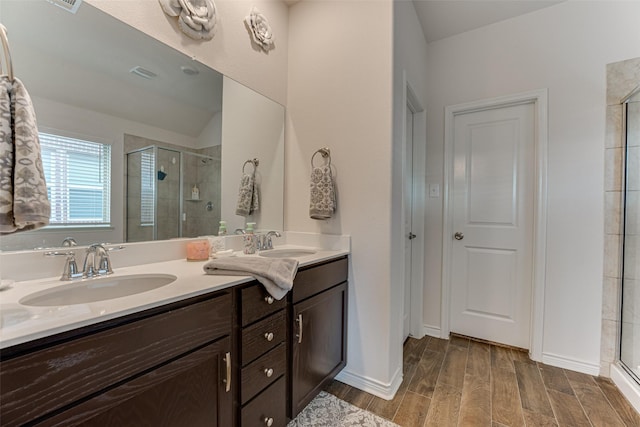 bathroom with vanity and an enclosed shower