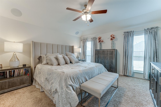 bedroom featuring ceiling fan, lofted ceiling, and light colored carpet