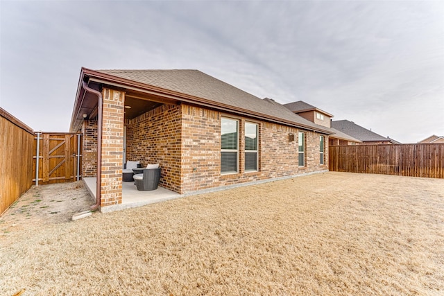 rear view of house featuring a patio