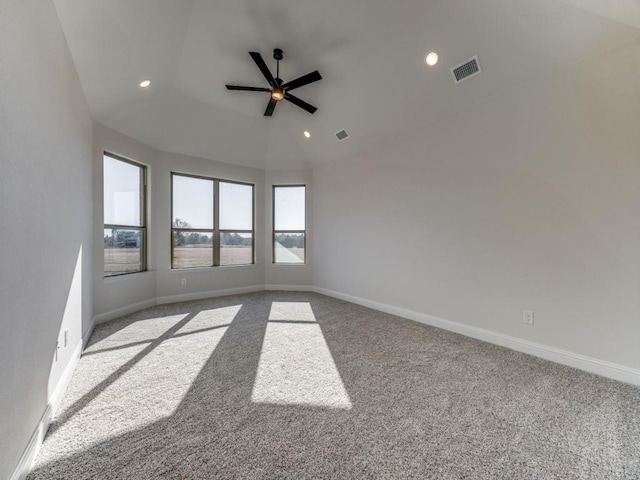 carpeted spare room featuring ceiling fan