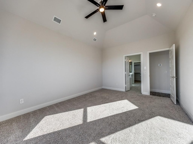 unfurnished bedroom with ceiling fan, vaulted ceiling, and carpet floors