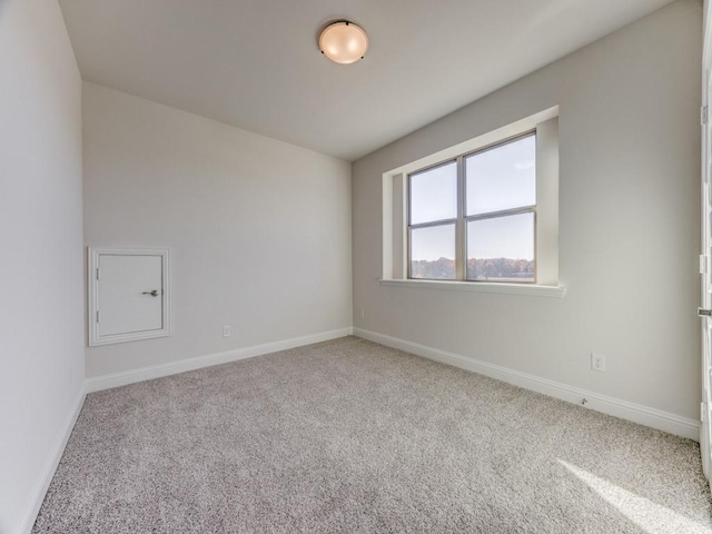 unfurnished room featuring carpet flooring