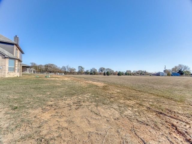 view of yard featuring a rural view