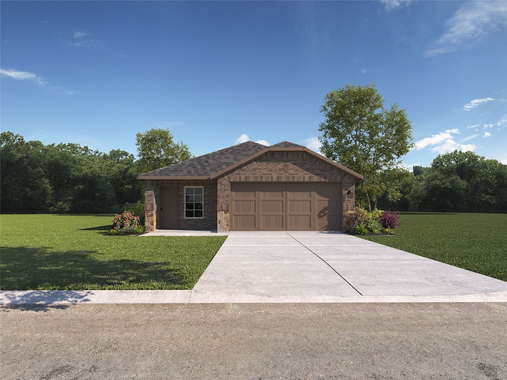 view of front of property with a garage and a front yard