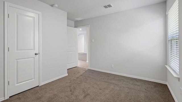 unfurnished bedroom featuring carpet floors