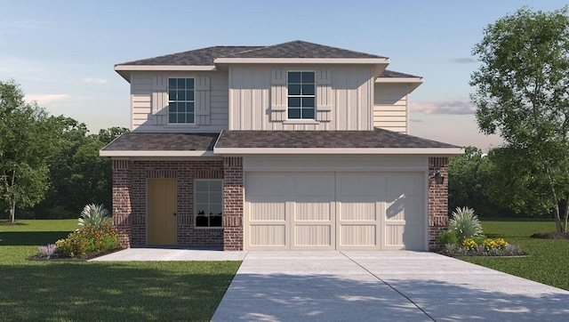 view of front of home with a garage and a yard