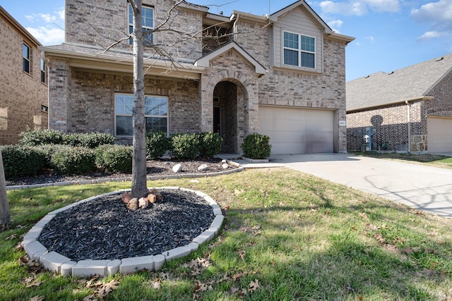 view of front of house featuring a garage and a front lawn