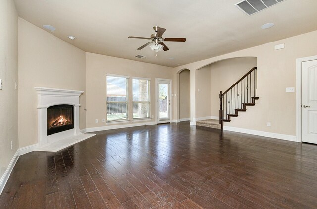 kitchen featuring decorative light fixtures, dishwasher, sink, and light stone counters