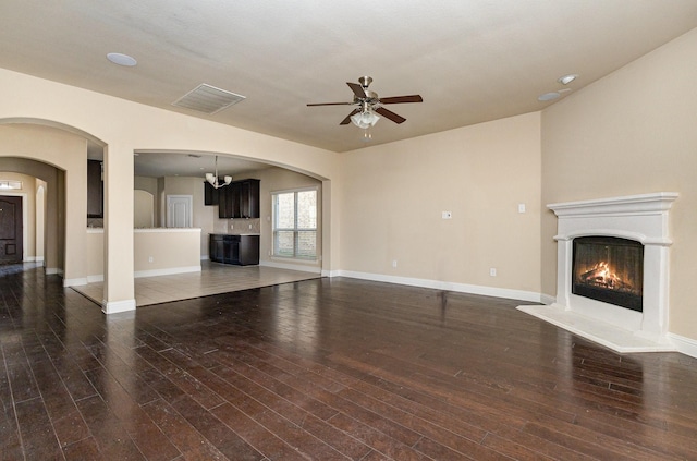 kitchen with decorative light fixtures, an inviting chandelier, sink, backsplash, and stainless steel dishwasher