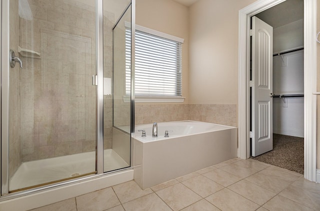 bathroom featuring independent shower and bath and tile patterned floors