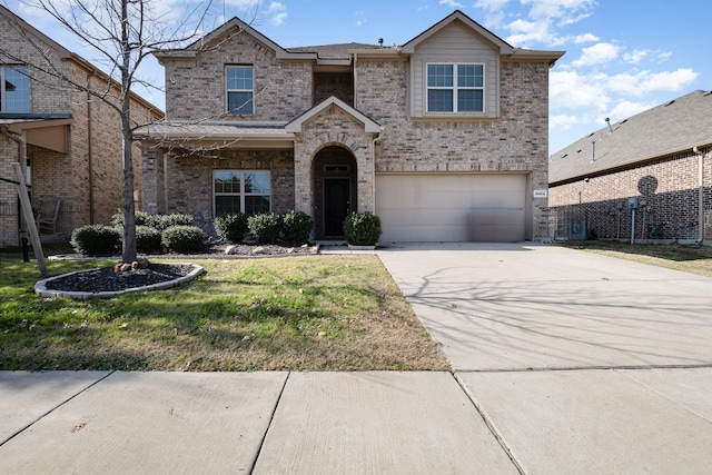 view of front facade with a garage and a front lawn