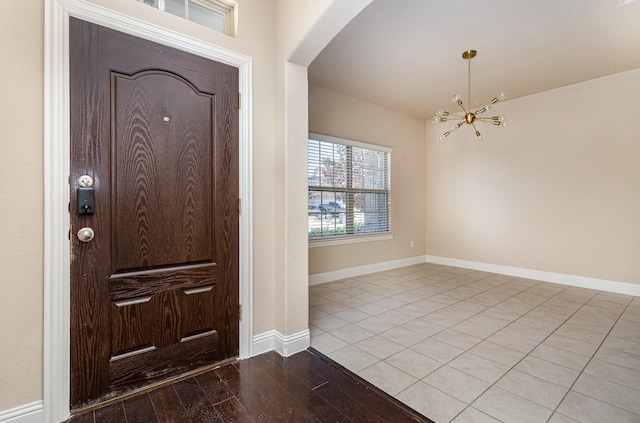 foyer featuring an inviting chandelier and light hardwood / wood-style floors