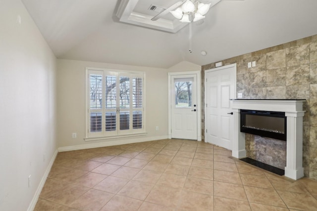 tiled foyer featuring ceiling fan and lofted ceiling