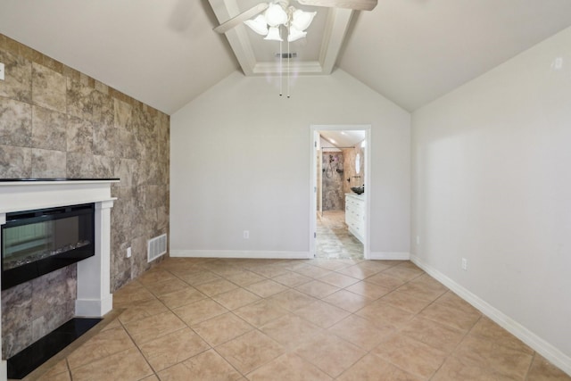 unfurnished living room with a fireplace, lofted ceiling with beams, ceiling fan, and light tile patterned flooring