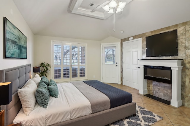 tiled bedroom featuring ceiling fan and vaulted ceiling