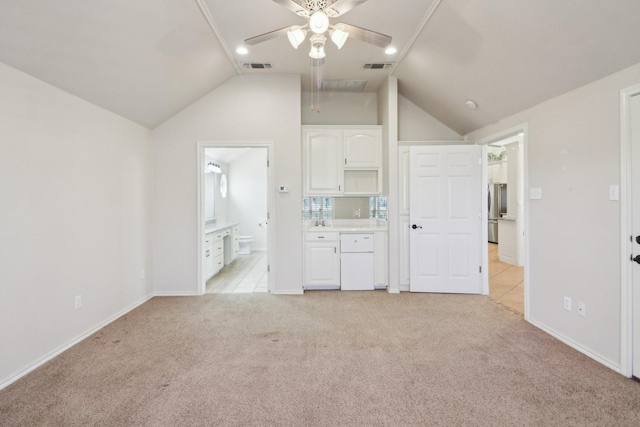 unfurnished living room featuring ceiling fan, light colored carpet, and lofted ceiling