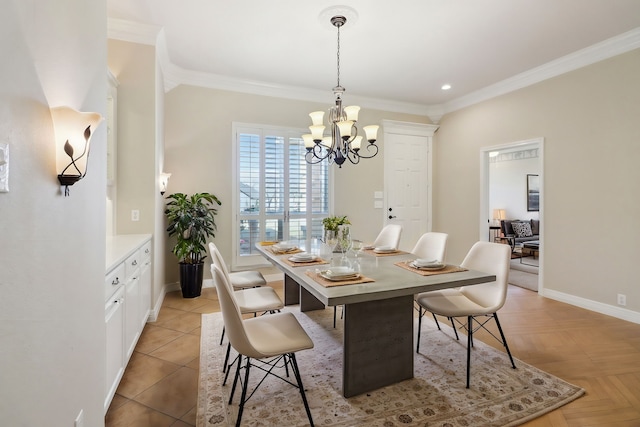 dining room with a chandelier and crown molding