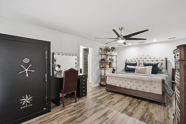 bedroom featuring ceiling fan and hardwood / wood-style floors