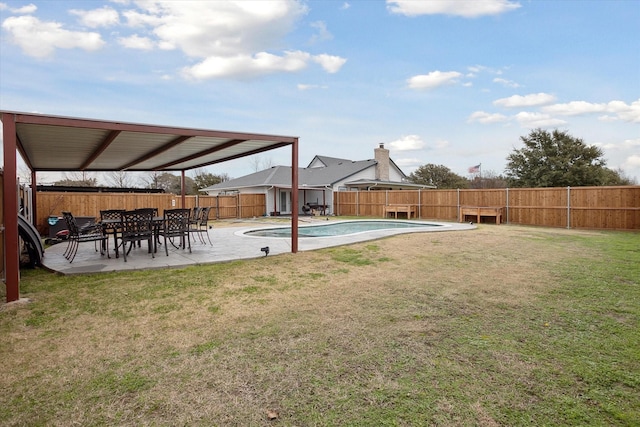 view of yard with a fenced in pool and a patio