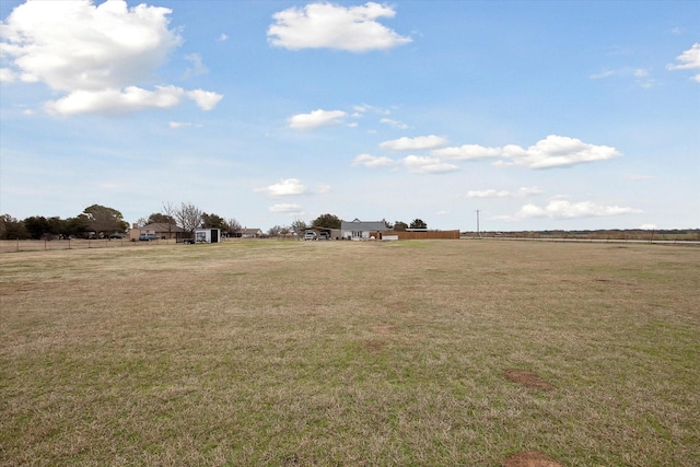 view of yard with a rural view