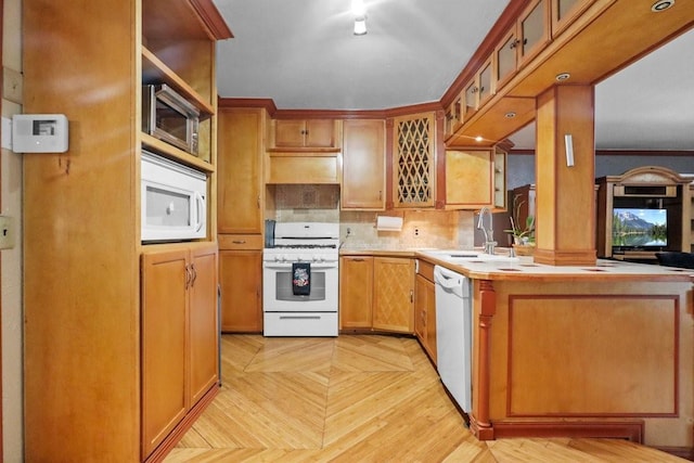 kitchen featuring light parquet floors, sink, and white appliances